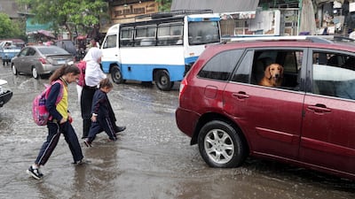 People make their way during rain shower in Cairo, Egypt. According to reports, showers are hitting Cairo as temperatures reach 21 degrees Celsius. EPA