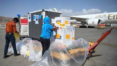 Unicef workers handle a supply of coronavirus vaccines at Kabul airport before commercial flights were stopped. Photo: AFP