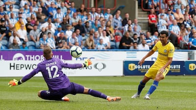 Chelsea's Pedro scores their third goal. Reuters