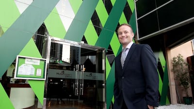 David Marosi works as a recruitment consultant in the day, then as a comedian at night. Jeffrey E Biteng / The National