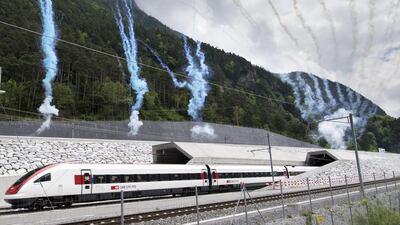 Fireworks are set off in celebration as the first train comes out of the of the Gotthard Base Tunnel on opening day. Laurent Gillieron / EPA