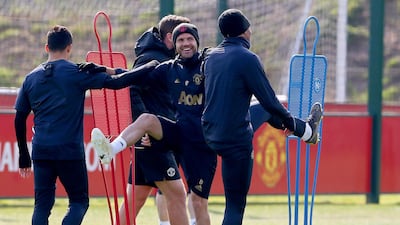 Manchester United's Juan Matam centre, trains with his teammates. EPA