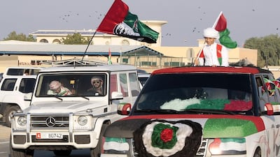 More than a hundred cars took to the streets of Umm al Quwain near the Clock roundabout as residents join in the festivities of the 42nd anniversary of the UAE. Jeffrey E Biteng / The National