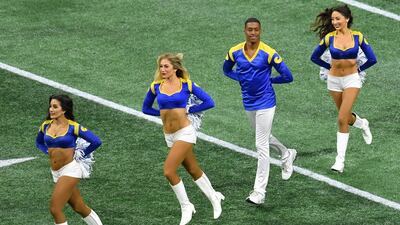 Rams cheerleader Quinton Peron, second right, performs with other cheerleaders during Super Bowl LIII between the New England Patriots and the Los Angeles Rams at Mercedes-Benz Stadium in Atlanta, Georgia. AFP