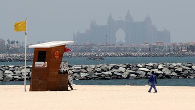 The weather will be sunny, partly cloudy and dusty at times in the UAE today. Chris Whiteoak / The National