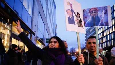 People gather to demonstrate against the arrival of Turkish President Erdogan in Brussels. EPA