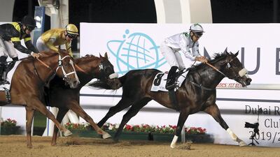 Fernando Jara, number 8, guides Dubai Avenue to victory in the Strata Trophy 1600m at the Meydan Racecourse in Dubai. Pawan Singh / The National