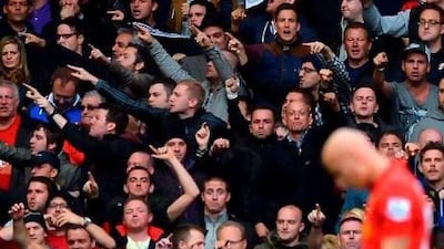 Manchester United supporters attempted to goad Liverpool fans into songs about the Munich Air Disaster during the match on Sunday. Followers of the Anfield club got on to social networking sites to wish Mark Halsey death from cancer. The referee was criticised for red-carding the Liverpool midfielder Jonjo Shelvey, pictured, for a challenge. Paul Ellis / AFP