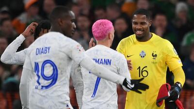 France goalkeeper Mike Maignan, right, celebrates with teammates after the 1-0 win over Republic of Ireland at Aviva Stadium in Dublin. AFP