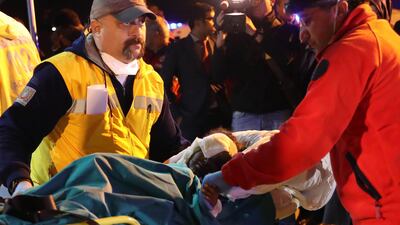 A victim of the latest explosion in Mogadishu is transported on a stretcher by Turkish emergency workers. A plane carrying 25 wounded Somalis arrived at the airport in Ankara on October 16, 2017. Adem Altan / AFP