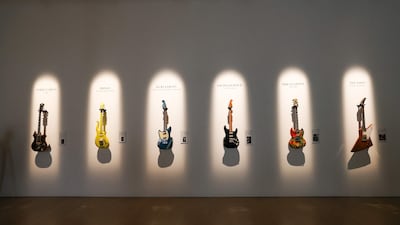 The guitars of Jerry Garcia, Prince, Kurt Cobain, David Gilmour, Eric Clapton and The Edge are displayed at Christie’s Los Angeles in Beverly Hills, California. AFP