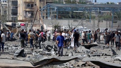 Gazans at the site of an Israeli strike in Maghazi. AFP
