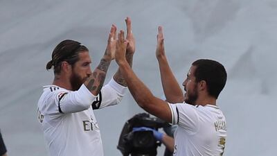 Sergio Ramos (L) celebrates with teammate Eden Hazard after scoring their second goal. EPA