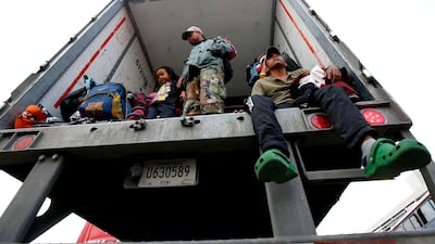 Central American migrants descend from a truck to be taken to a shelter, in the outskirts of Zapotlanejo, Jalisco state, Mexico. AFP