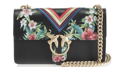Tropical blooms and sporty stripes set against a sleek, black background make this a great day-to-night investment; Dh1,475. Courtesy of Pinko