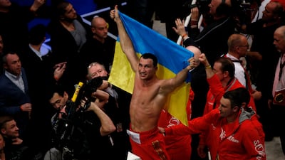 Wladimir Klitschko of Ukraine celebrates after winning the IBF, WBA, WBO and IBO World Championship fight in 2014. Getty