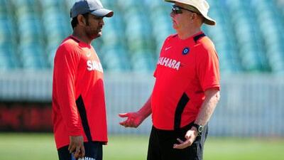 The India coach Duncan Fletcher, right, chats with captain MS Dhoni during a net session in Taunton, England.