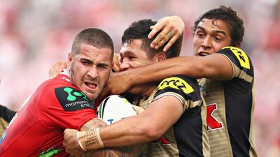 Joel Thompson of the Dragons is tackled by Tyrone Peachey and Te Maire Martin of the Panthers during the round four NRL match between the St George Illawarra Dragons and the Penrith Panthers at WIN Stadium in Sydney, Australia. Mark Kolbe / Getty Images