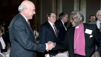 State President of South Africa Frederik Willem de Klerk with Archbishop Desmond Tutu, right, in Johannesburg in September 1991 at the historic National Peace accord aimed at ending violence in black townships. AFP