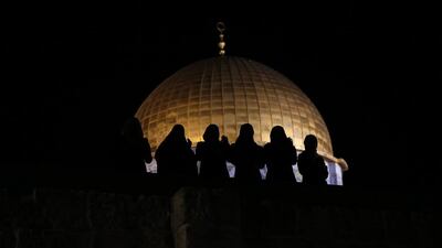 Palestinian Muslim worshippers pray in front of the the Dome of the Rock, at the al-Aqsa Mosque compound, during 'tarawih' prayer, marking the first evening of Ramadan. Ahmad Gharabli/ AFP