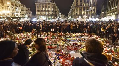 Hundreds of people come together at the Place de la Bourse In Brussels to mourn victims of the attacks. (AP Photo/Martin Meissner)