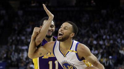 Golden State Warriors' Stephen Curry s fouled by Los Angeles Lakers' Tyler Ennis on Wednesday, April 12, 2017, in Oakland, California. Marcio Jose Sanchez / AP Photo