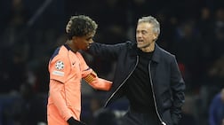 PSG head coach Luis Enrique consoles Lamine Yamal. EPA