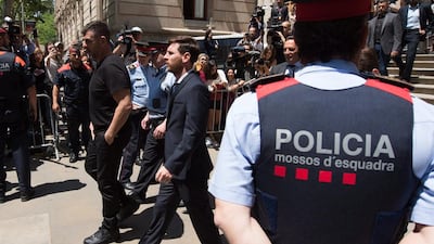 Lionel Messi leaves the courthouse. Lionel Messi and his father Jorge Messi, who manages his financial affairs, are accused of defrauding the Spanish Tax Agency of €4.1 million. Alex Caparros / Getty Images