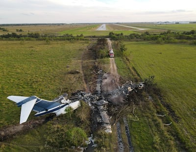 The remnants of an aircraft, which caught fire soon after a failed take-off attempt at Houston Executive Airport. Houston Chronicle via AP