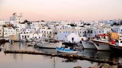 Boats in the harbour in Naousa, Paros. With its fertile landscape, hidden stretches of golden beaches and excellent local cuisine, the island has a devoted following even in low season.