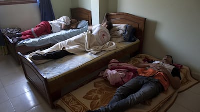 Paramedics resting in the early evening after a long day of assisting causalities from Israeli air strikes and other emergencies. Heidi Levine for The National