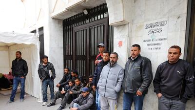 Joblessness has swelled in Arab countries rocked by instability as economic growth has faltered. Above, unemployed people gather in Tunisia's labour ministry to protest against the results of a recruitment exam. Fethi Belaid / AFP