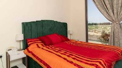 It has three bedrooms, a maid's room, and a landscaped garden