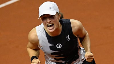 World No 1 Iga Swiatek celebrates after winning the Stuttgart Open final against Aryna Sabalenka on April 23, 2023. AFP