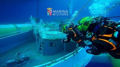 Italian Navy divers working to raise the wreck of a boat on June 29, 2016 that capsized and sank in the Mediterranean on April, 18 2015 with the loss of 800 refugees from Libya. marina Militare/ Agence France-Presse