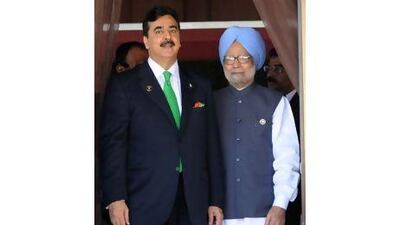 Indian Prime Minister Manmohan Singh, right, with his Pakistani counterpart Yousaf Raza Gilani during the 17th South Asian Association for Regional Cooperation summit in Addu. Raveendran / AFP