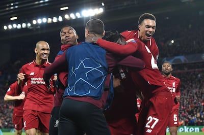 Liverpool celebrate after scoring their fourth goal during the UEFA Champions league semi-final second leg at Anfield on May 7, 2019. AFP