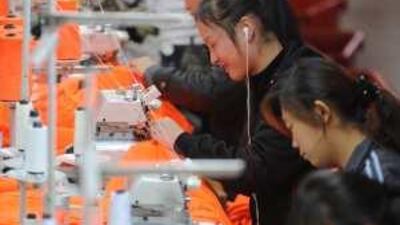 Chinese workers sew in Wuhu. The Chinese have emphasised personal connections in business for centuries.