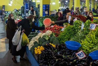 People shop for fresh fruit and vegetables at an open-air market in Istanbul, Turkey. Getty Images