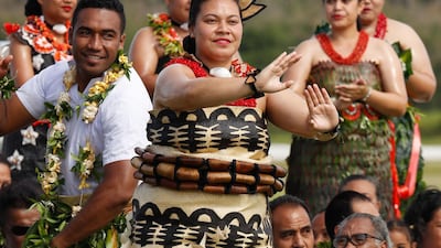 Dancers greet Meghan and Harry in Tonga. Getty Images