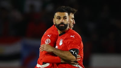 Egypt's Mohamed Salah embraces Hamdy Fath after losing the Afcon third place playoff penalty shootout against Nigeria in Casablanca. Reuters