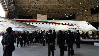 Guests look at a Mitsubishi Regional Jet during the ceremony at the Nagoya airport in Komaki. Toshifumi Kitamura / AFP