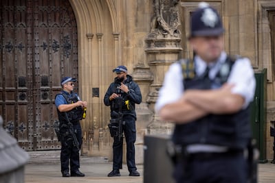 Armed police officers on duty outside parliament. Getty Images