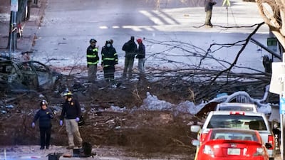 Investigators work at the scene of an explosion in Nashville, Tenn. The explosion that shook the largely deserted streets of downtown Nashville early Christmas morning shattered windows, damaged buildings and wounded three people. Authorities said they believed the blast was intentional. AP