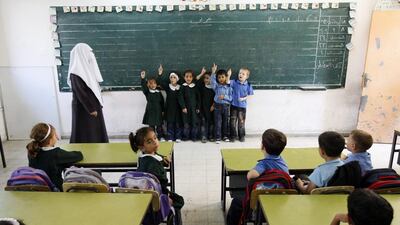 Palestinian elementary students attend a class at a school in Gaza City. For years, Palestinians have been subjected to a cruel Israeli siege. (AFP PHOTO/MOHAMMED ABED)