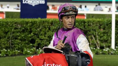 Sandro Paiva won the Emirates.com race riding Secret Trade at the Meydan racecourse. Chris Whiteoak / The National