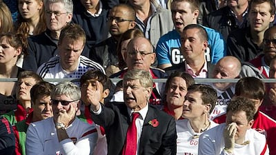 Arsene Wenger, centre, has closed the gap on the Premier League pacesetters with Arsenal's impressive form.