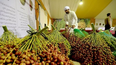 Dibbs, or date molasses, is produced in abundance and is a vitamin-packed natural sweetener that can substitute for imported molasses, syrups and processed sweeteners. Pictured: Abdullah Al Mazrouei, a volunteer at last year’s Liwa Date Festival, checks dates before they are judged. Ravindranath K / The National