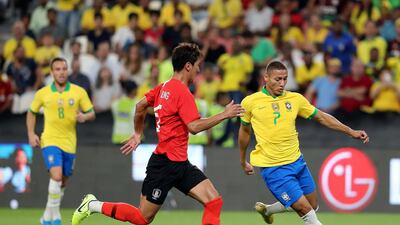 Richarlison takes on Jung Woo-young during the game between Brazil and South Korea. Chris Whiteoak / The National