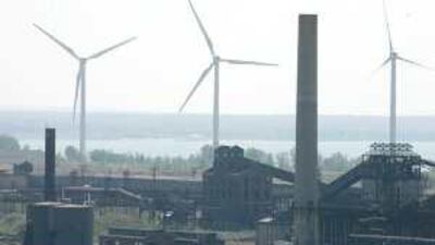 Quiet revolution: wind turbines next to derelict factories near Lake Erie in the US. The UAE is keen to embrace clean energy concepts, and has a particular interest in the redirection of carbon pollution to underground storage.